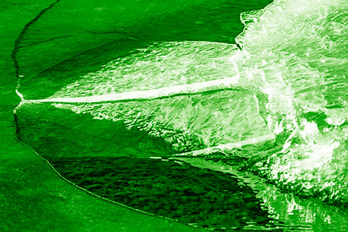 Abstract Ice Sculpture Forms Atop Frozen River (Green Shade Photo)