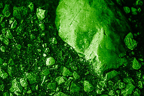 Alien Skull Rock Face Emerging Atop Dirt Surface (Green Shade Photo)
