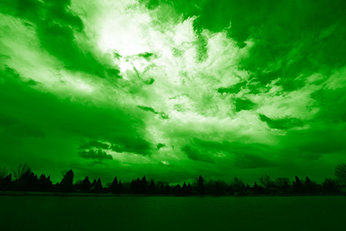 Clouds Spiraling Above Dark Lit Lake (Green Shade Photo)