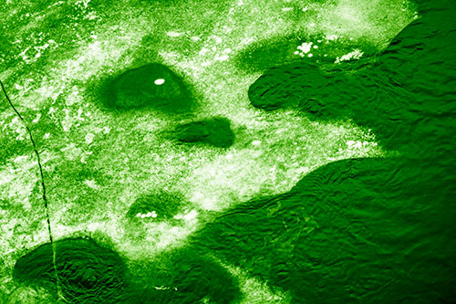 Disintegrating Ice Face Melting Among Flowing River Water (Green Shade Photo)