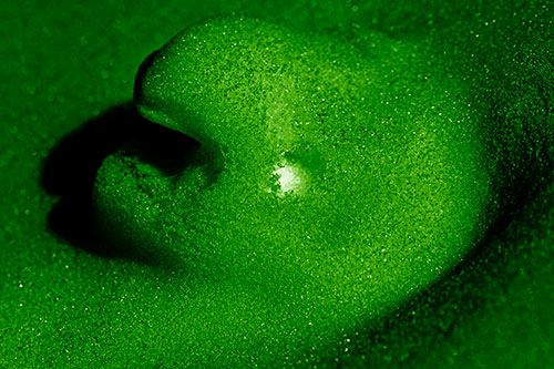 Glowing Eyed Snow Face Emerges Above Soil (Green Shade)