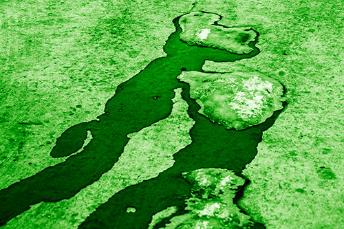 Melting Ice Puddles Forming Water Streams (Green Shade Photo)