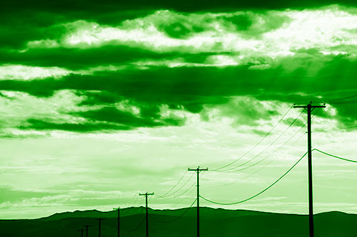 Powerline Silhouette Entering Mountain Range (Green Shade Photo)