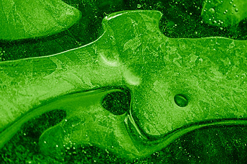 Swirling Frozen Smiling Bubble Eyed River Ice Face (Green Shade Photo)