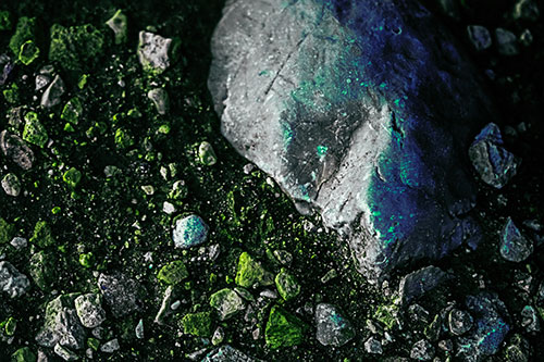 Alien Skull Rock Face Emerging Atop Dirt Surface (Green Tint Photo)