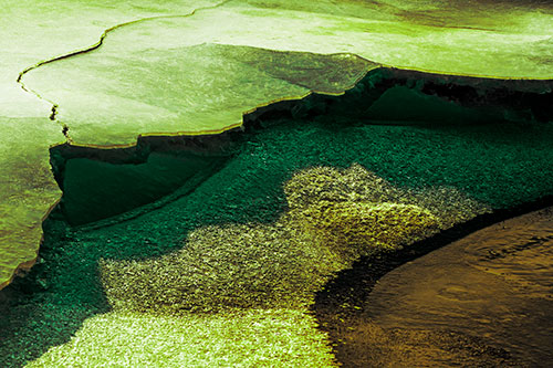 Cracked Ice Frozen Shoreline Melting (Green Tint Photo)