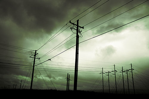 Crossing Powerlines Beneath Rainstorm (Green Tint Photo)
