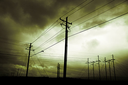 Crossing Powerlines Beneath Rainstorm (Green Tint Photo)