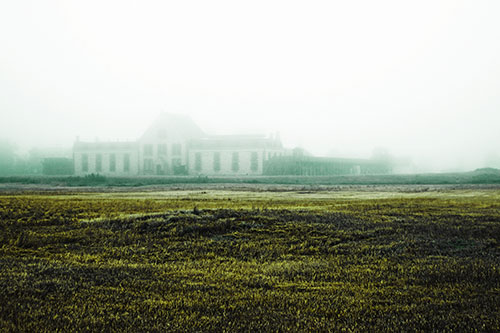 Dense Fog Consumes Distant Historic State Penitentiary (Green Tint Photo)