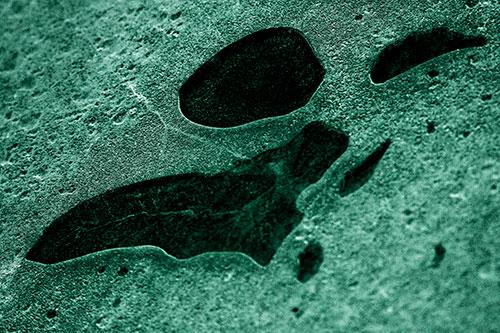 Distorted Skull Face Within Frozen Ice (Green Tint)