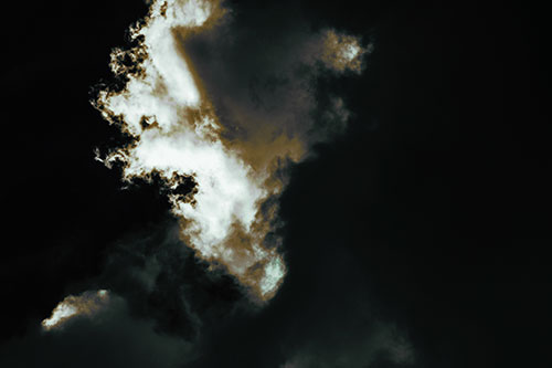 Evil Cloud Face Snarls Among Sky (Green Tint Photo)