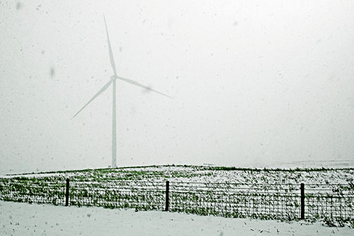 Fenced Wind Turbine Among Blowing Snow (Green Tint)