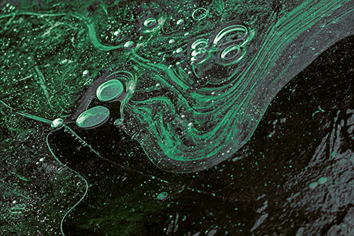 Frozen Bubble Clusters Among Twirling River Ice (Green Tint Photo)