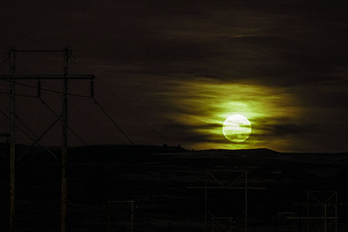 Full Moonrise Behind Mountain (Green Tint Photo)