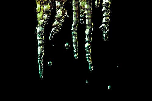 Jagged Melting Icicles Dripping Water (Green Tint Photo)