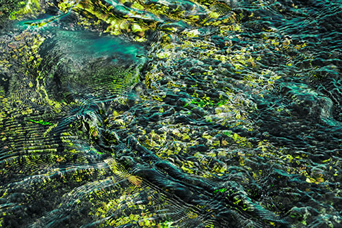 Large Algae Rock Creating River Water Ripples (Green Tint Photo)