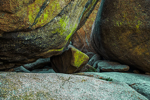 Large Crowded Boulders Leaning Against One Another (Green Tint Photo)
