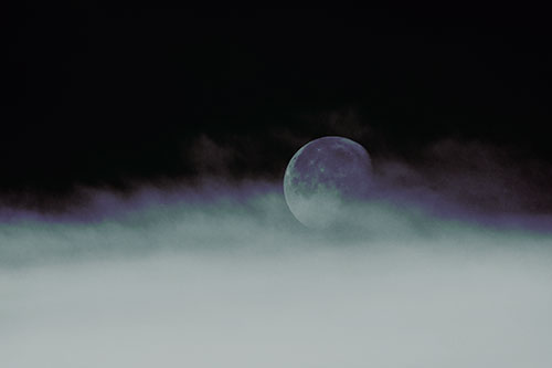Moon Rolling Along Clouds (Green Tint Photo)