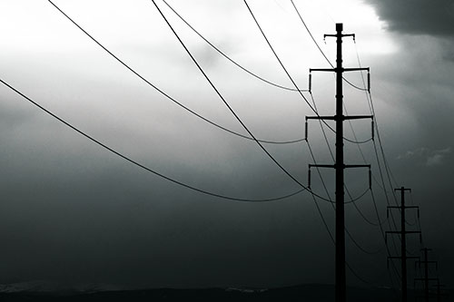 Powerlines Receding Into Thunderstorm (Green Tint Photo)
