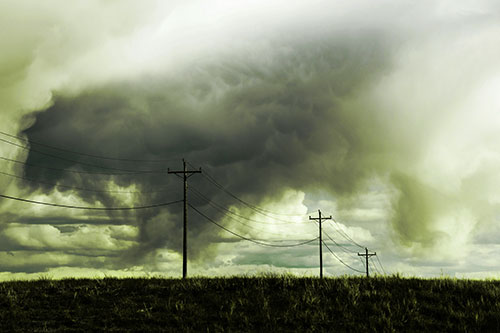 Rainstorm Clouds Twirl Beyond Powerlines (Green Tint)