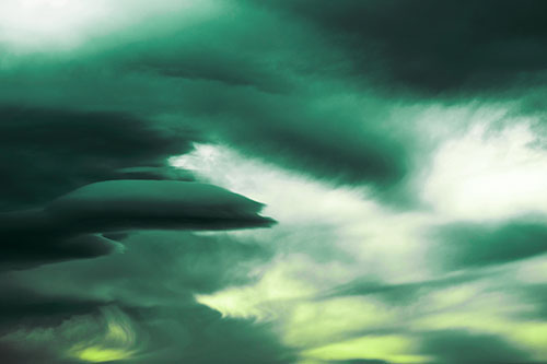 Smooth Cloud Sails Along Swirling Formations (Green Tint Photo)