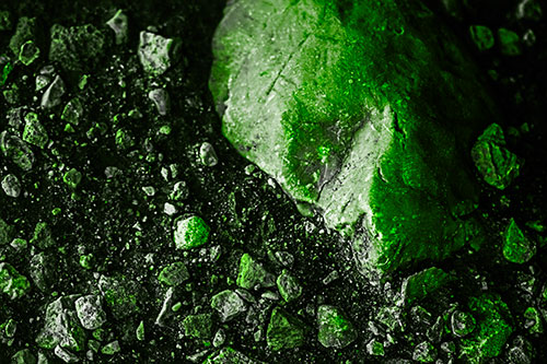 Alien Skull Rock Face Emerging Atop Dirt Surface (Green Tone Photo)