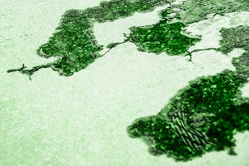 Creeping Water Puddle Across Concrete Pavement (Green Tone)