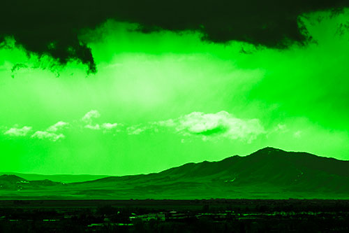 Dark Cloud Mass Above Mountain Range Horizon (Green Tone Photo)