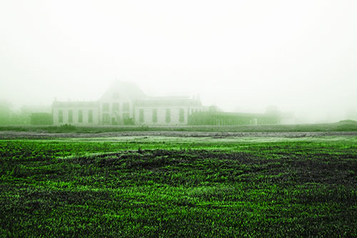 Dense Fog Consumes Distant Historic State Penitentiary (Green Tone Photo)