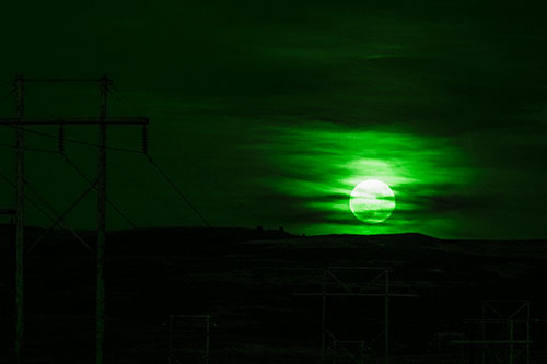 Full Moonrise Behind Mountain (Green Tone Photo)