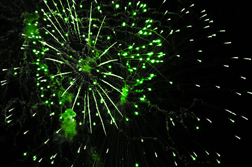 Multiple Firework Explosions Send Light Orbs Flying (Green Tone Photo)