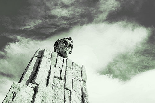 Presidents Statue Standing Tall Among Clouds (Green Tone Photo)