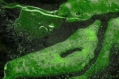Scared River Ice Face Separating Among Frigid Water (Green Tone)
