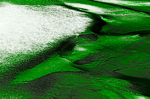 Sloping Ice Melting Atop River Water (Green Tone Photo)
