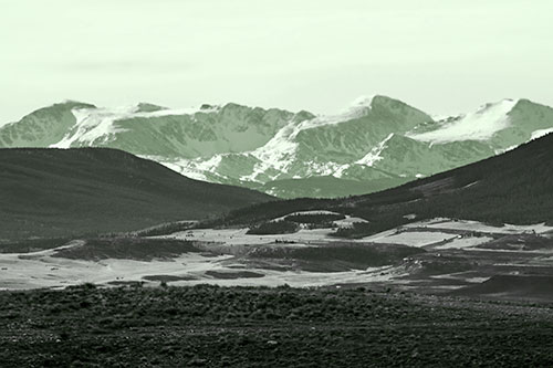 Snow Capped Mountains Behind Hills (Green Tone Photo)