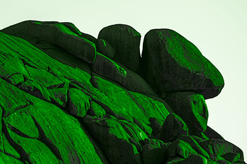 Sunlight Casting Shadows On Mountain Of Rocks (Green Tone Photo)