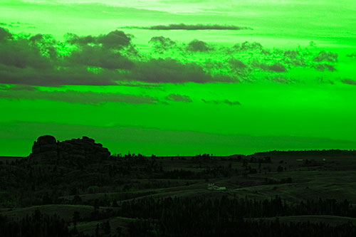 Sunrise Over Rock Formations On The Horizon (Green Tone Photo)