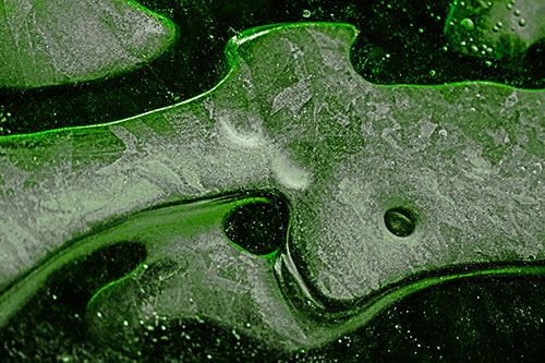 Swirling Frozen Smiling Bubble Eyed River Ice Face (Green Tone Photo)