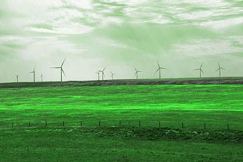 Wind Turbines Scattered Along The Prairie Horizon (Green Tone Photo)
