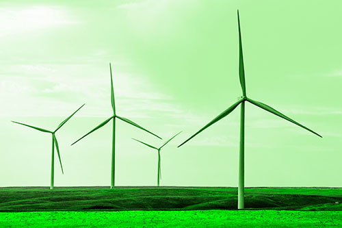 Wind Turbines Standing Tall Among Grassy Pasture (Green Tone)