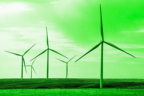 Wind Turbines Standing Tall On Green Pasture (Green Tone Photo)