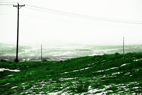 Winter Snowstorm Approaching Powerlines (Green Tone Photo)