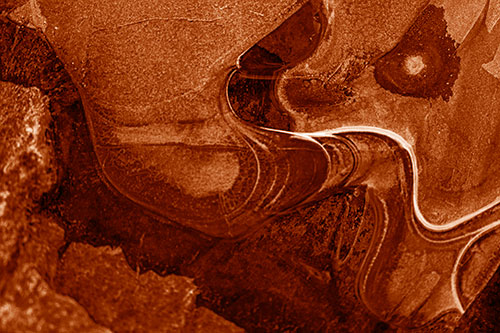 Angry Fuming Frozen River Ice Face (Orange Shade Photo)