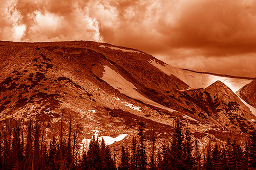 Clouds Cover Melted Snowy Mountain Range (Orange Shade Photo)