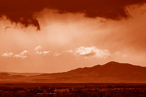 Dark Cloud Mass Above Mountain Range Horizon (Orange Shade Photo)