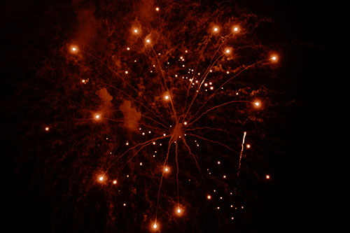 Firework Light Orbs Free Falling After Explosion (Orange Shade Photo)