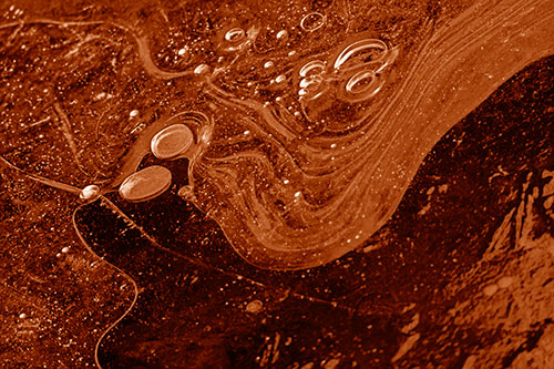 Frozen Bubble Clusters Among Twirling River Ice (Orange Shade Photo)
