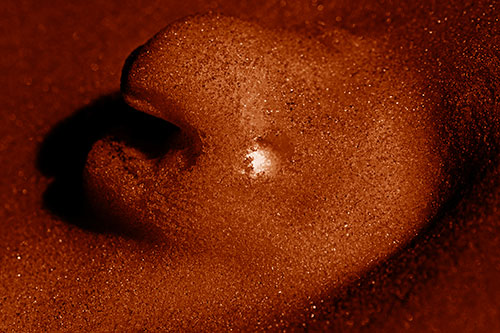 Glowing Eyed Snow Face Emerges Above Soil (Orange Shade)