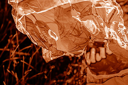 Growling Plastic Charmin Bag Among Grass (Orange Shade)