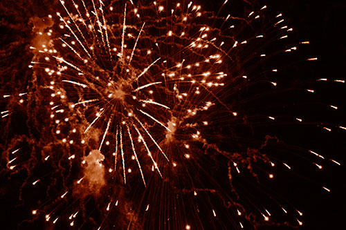 Multiple Firework Explosions Send Light Orbs Flying (Orange Shade Photo)